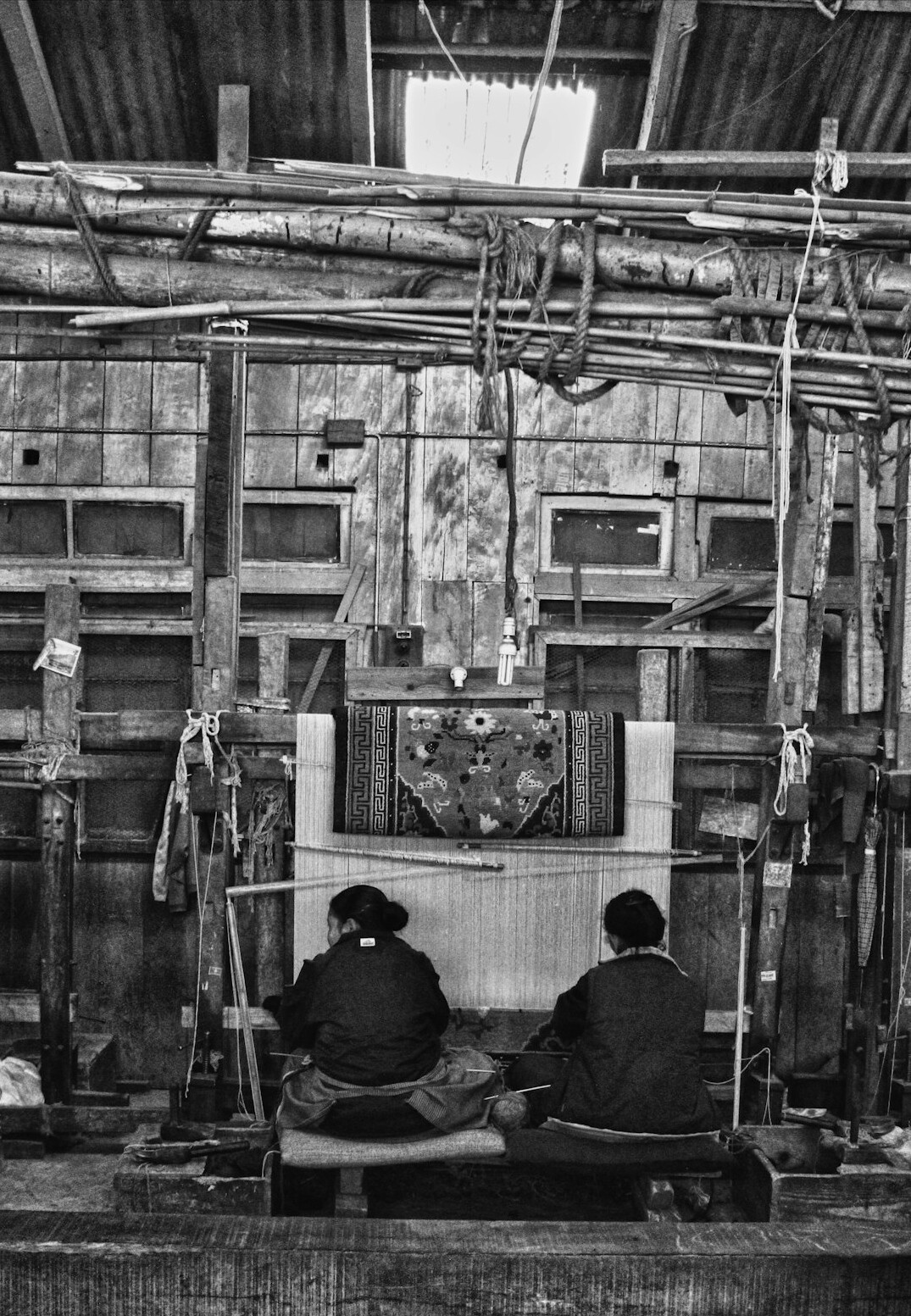 Wide view of a television production gallery with operators seated at desks