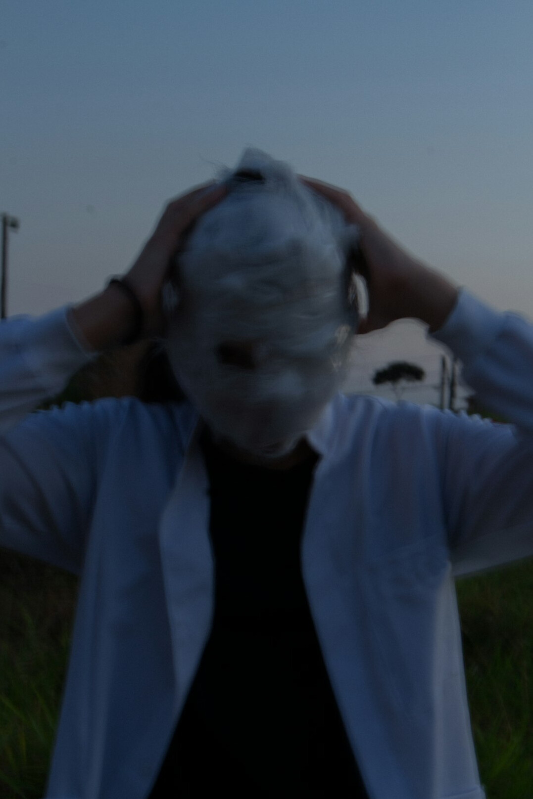 Portrait of a middle-aged white British man with short grey hair wearing a dark shirt and headset